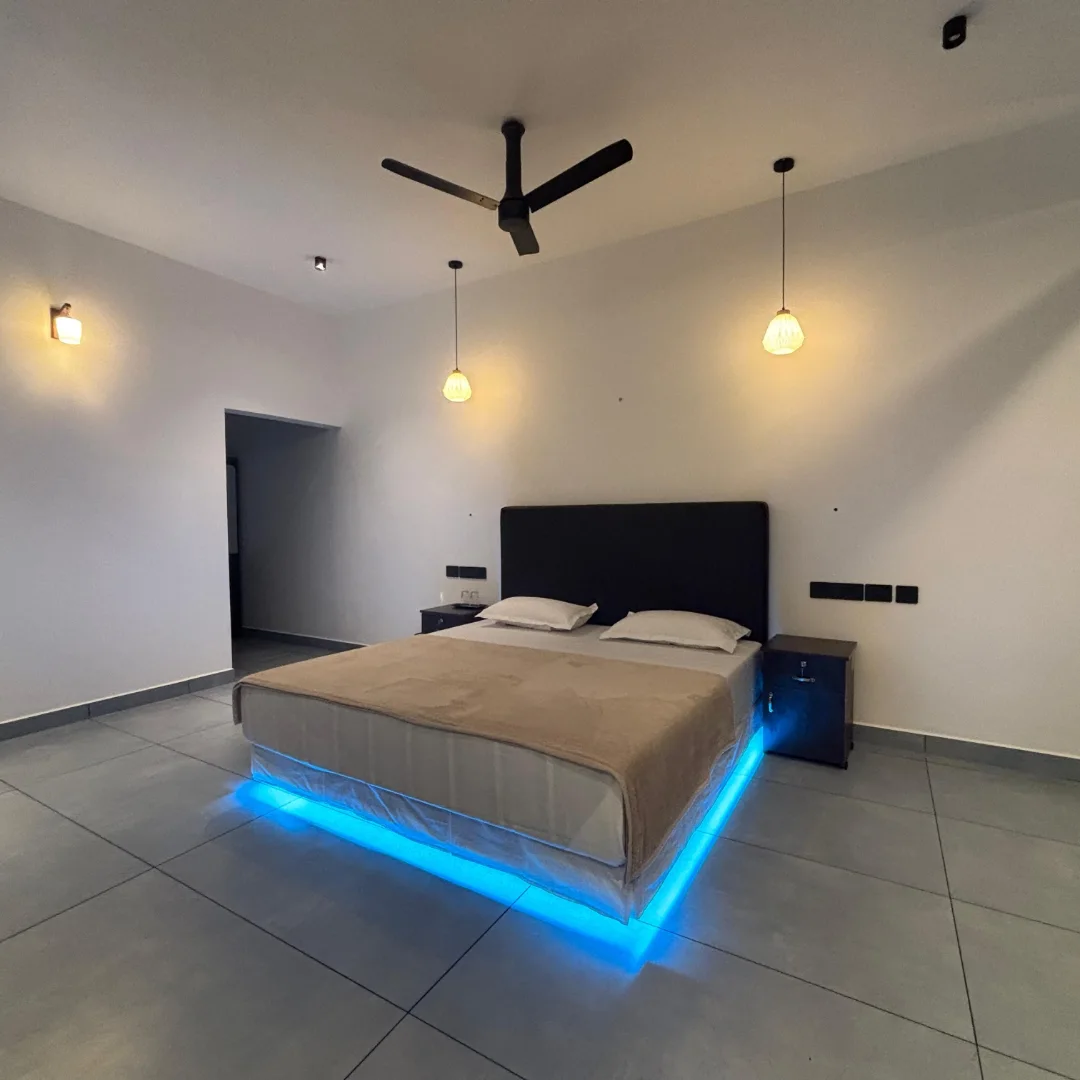 Spacious bedroom with blue LED lighting