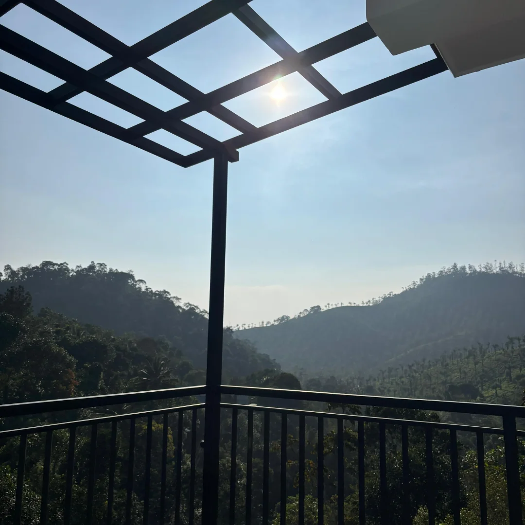 Stunning view of green mountains and forests from the balcony pergola
